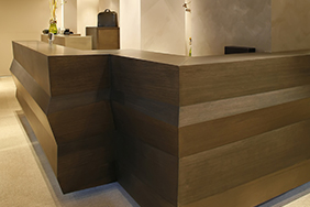 University Reception - dark-wood-reception-desk