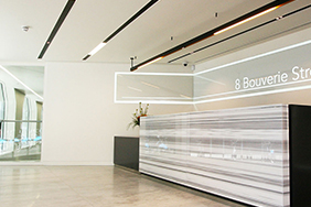 University Reception - marble-and-wood-reception-desk